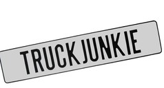 Wei�es Namensschild aus Blech mit schwarzem Rand und der Aufschrift 