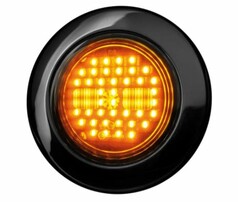 Runde, schwarze Heckleuchte mit klarer, get�nter Linse und leuchtenden, bernsteinfarbenen LEDs als Blinklicht.