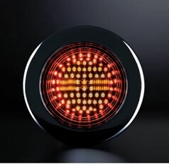 Runde, schwarze Heckleuchte Dark Knight mit klar get�nter Linse, rot und orange leuchtend.