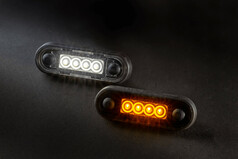 LED-Begrenzungsleuchten mit schwarzem Geh�use, eine leuchtet wei�, die andere gelb.