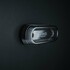 Strands Positionsleuchte LED GRAVITY mit schwarzem Geh�use und dunkler Linse, montiert auf einer dunklen Oberfl�che.